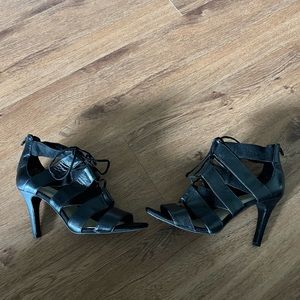 Gently worn lace up Nine West black open toe pumps